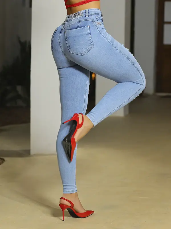 Calça Skinny Modeladora com Lavado Claro e Detalhes Navalhados Pit Bull Jeans Luxo